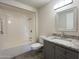 Bathroom with shower/tub combo, granite vanity and tile floor at 10976 W Coggins Dr, Sun City, AZ 85351