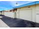 Attached garage with automatic door opener and exterior access at 10976 W Coggins Dr, Sun City, AZ 85351