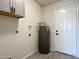 Laundry room with washer/dryer hookups and water heater at 10976 W Coggins Dr, Sun City, AZ 85351