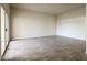 Living room with grey tile floor and sliding door at 10976 W Coggins Dr, Sun City, AZ 85351
