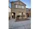 Two-story house with balcony, attached garage, and landscaping at 1127 W Auburn St, Mesa, AZ 85201