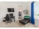 Bedroom with en-suite bathroom and gaming setup at 12058 N Loma Linda St, Surprise, AZ 85388