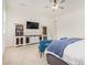 Relaxing bedroom with built-in entertainment center and seating at 12058 N Loma Linda St, Surprise, AZ 85388
