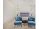 Bright bedroom featuring a comfortable bed and two accent chairs at 12058 N Loma Linda St, Surprise, AZ 85388