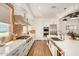 Modern kitchen with white cabinets, stainless steel appliances, and large island at 12058 N Loma Linda St, Surprise, AZ 85388