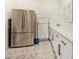 Laundry room with stainless steel fridge and cabinets at 12058 N Loma Linda St, Surprise, AZ 85388