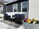 Relaxing patio with wicker furniture and colorful flowers at 12058 N Loma Linda St, Surprise, AZ 85388
