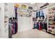 Large walk-in closet offering ample storage space for clothes and shoes at 12058 N Loma Linda St, Surprise, AZ 85388