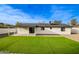 Home exterior showcasing backyard with artificial turf at 1243 N Terripin --, Mesa, AZ 85207