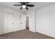 Well-lit bedroom with ceiling fan and double door closet at 1243 N Terripin --, Mesa, AZ 85207