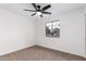 Spacious bedroom featuring a large window and ceiling fan at 1243 N Terripin --, Mesa, AZ 85207