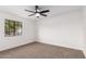 Simple bedroom with carpet and a large window at 1243 N Terripin --, Mesa, AZ 85207