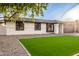 Single-story home with artificial turf and new landscaping at 1243 N Terripin --, Mesa, AZ 85207