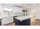 Modern kitchen with white cabinets, quartz island, and new appliances at 1243 N Terripin --, Mesa, AZ 85207