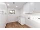 Laundry room with white cabinets and quartz countertop at 1243 N Terripin --, Mesa, AZ 85207