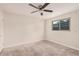 Bright bedroom with ceiling fan and window at 1259 W 6Th Dr, Mesa, AZ 85202