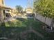 Backyard with grassy area and fruit trees at 12701 W Paradise Dr, El Mirage, AZ 85335