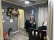 Bright bedroom with a single bed, gaming chair, and plush toys at 12701 W Paradise Dr, El Mirage, AZ 85335