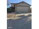 Two-story house with attached garage and driveway at 12701 W Paradise Dr, El Mirage, AZ 85335