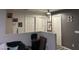 Upstairs hallway with three doors and framed art at 12701 W Paradise Dr, El Mirage, AZ 85335