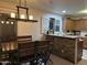 Bright kitchen with island and modern lighting at 12701 W Paradise Dr, El Mirage, AZ 85335