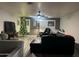 Living room with a cozy sectional sofa and Christmas tree at 12701 W Paradise Dr, El Mirage, AZ 85335