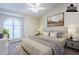 Virtually staged bedroom with a king-size bed and large window at 12851 N Mimosa Dr # 102, Fountain Hills, AZ 85268