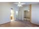 Bedroom with mirrored closet doors and access to bathroom at 12851 N Mimosa Dr # 102, Fountain Hills, AZ 85268