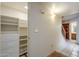 Hallway with built-in shelving and linen closet at 12851 N Mimosa Dr # 102, Fountain Hills, AZ 85268