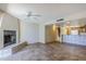 Spacious living room with tile floors, fireplace, and ceiling fan at 12851 N Mimosa Dr # 102, Fountain Hills, AZ 85268