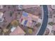 Aerial view of a well-maintained property featuring solar panels, mature landscaping, and a patio at 12953 W Figueroa Dr, Sun City West, AZ 85375