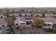 Aerial view of a desert property featuring solar panels, lush landscaping, and a covered patio at 12953 W Figueroa Dr, Sun City West, AZ 85375