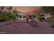 Backyard oasis with a patio, lush desert landscaping, and tranquil setting at 12953 W Figueroa Dr, Sun City West, AZ 85375