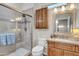 Updated bathroom featuring a tiled shower, modern vanity, and stylish fixtures at 12953 W Figueroa Dr, Sun City West, AZ 85375