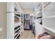 Spacious walk-in closet featuring custom shelving for optimal storage and organization at 12953 W Figueroa Dr, Sun City West, AZ 85375
