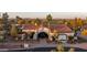 Corte Bella Golf Club featuring desert landscaping, mature palm trees and beautiful architecture at 12953 W Figueroa Dr, Sun City West, AZ 85375