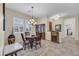 Inviting dining room with ample natural light, tile floors, and classic furnishings at 12953 W Figueroa Dr, Sun City West, AZ 85375
