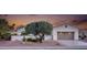 Charming single-story home featuring a desert landscape, front courtyard, and a two-car garage at 12953 W Figueroa Dr, Sun City West, AZ 85375