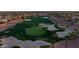 Aerial view of the lush green golf course and sand traps in the Corte Bella community at 12953 W Figueroa Dr, Sun City West, AZ 85375