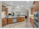 Spacious kitchen showcasing updated appliances, granite counters, and plenty of cabinet storage space at 12953 W Figueroa Dr, Sun City West, AZ 85375