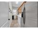 Functional laundry area featuring a washer, dryer, refrigerator, and storage cabinets at 12953 W Figueroa Dr, Sun City West, AZ 85375