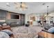 Comfortable living room with custom fireplace and console and adjacent bar seating at 12953 W Figueroa Dr, Sun City West, AZ 85375