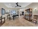 Spacious living area featuring tile flooring, natural light, piano, and comfortable seating at 12953 W Figueroa Dr, Sun City West, AZ 85375