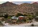 Aerial view showcasing a contemporary home's unique architecture and landscape at 13176 E Summit Dr, Scottsdale, AZ 85259