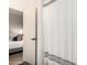 Simple bathroom with shower and white linen curtains at 1357 E Bradstock Way, San Tan Valley, AZ 85140