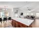 Open kitchen with island and view into the living room at 1357 E Bradstock Way, San Tan Valley, AZ 85140