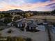 Modern home with a long driveway and beautiful mountain views at 14821 E Chandler Heights Rd, Chandler, AZ 85249