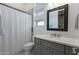 Clean bathroom with shower, toilet, vanity with white countertop at 14821 E Chandler Heights Rd, Chandler, AZ 85249