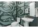 Powder room with pedestal sink and artistic wall design at 14821 E Chandler Heights Rd, Chandler, AZ 85249
