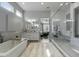 Luxurious bathroom with soaking tub, walk-in shower, and double vanity at 14821 E Chandler Heights Rd, Chandler, AZ 85249